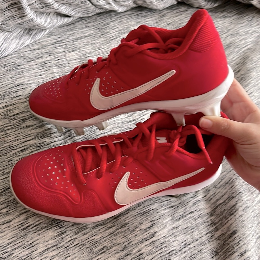 Red Nike softball cleats for youth girls